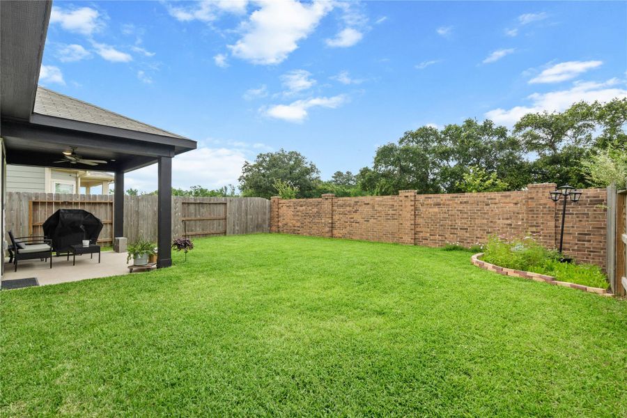 Plenty of green space provides room for pets, play, or future outdoor enhancements, making this backyard both functional and inviting.