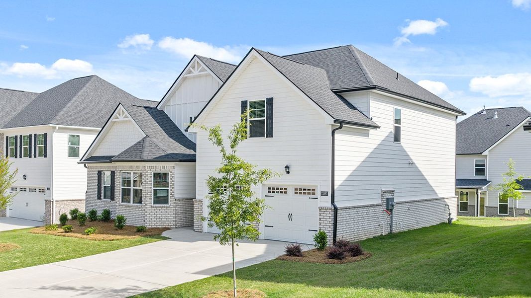 Front exterior of a new home in Wildwood, Covington, GA, highlighting curb appeal (Image 24). Front exterior of a new home in Wildwood, Covington, GA, highlighting curb appeal (Image 24).
