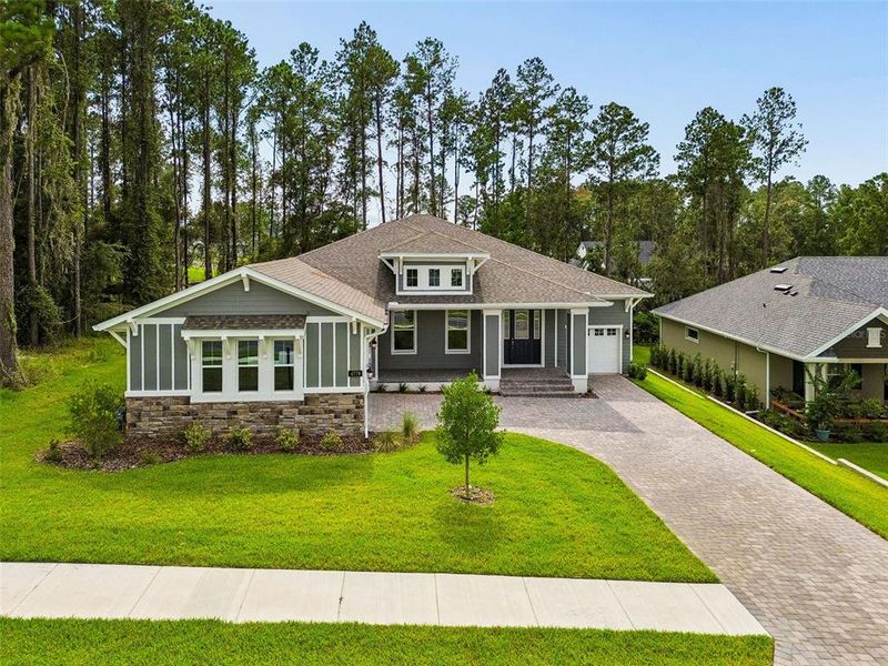 Front exterior of a new home in Southern Hills Plantation, Brooksville, FL, highlighting curb appeal (Image 28). Front exterior of a new home in Southern Hills Plantation, Brooksville, FL, highlighting curb appeal (Image 28).