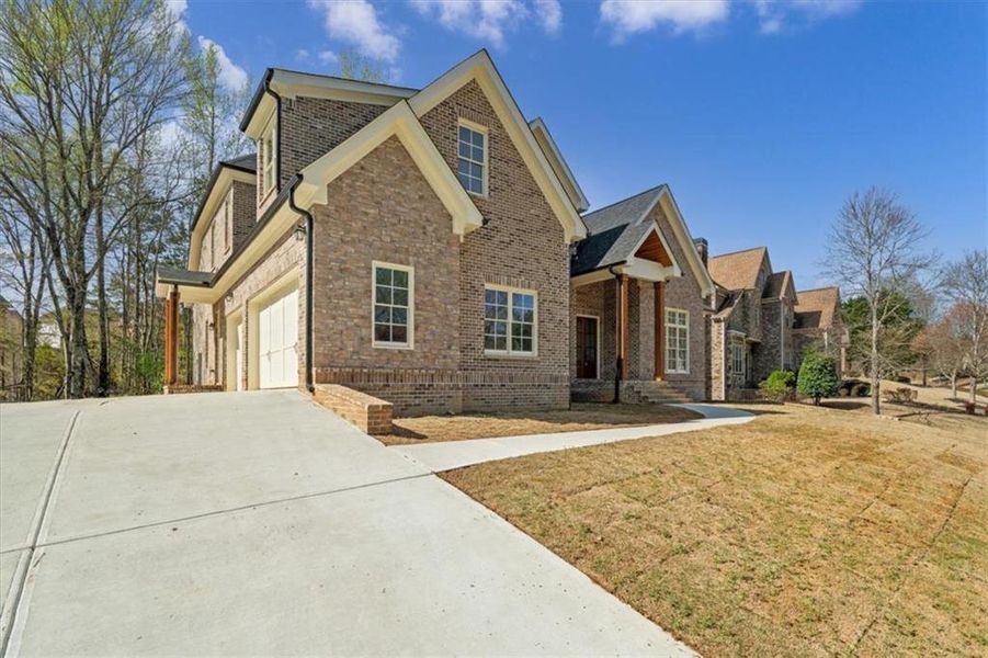 Front exterior of a new home in , Douglasville, GA, highlighting curb appeal (Image 25).