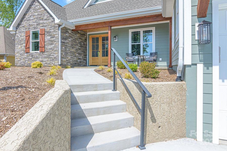 Front exterior of a new home in , Hendersonville, NC, highlighting curb appeal (Image 21).