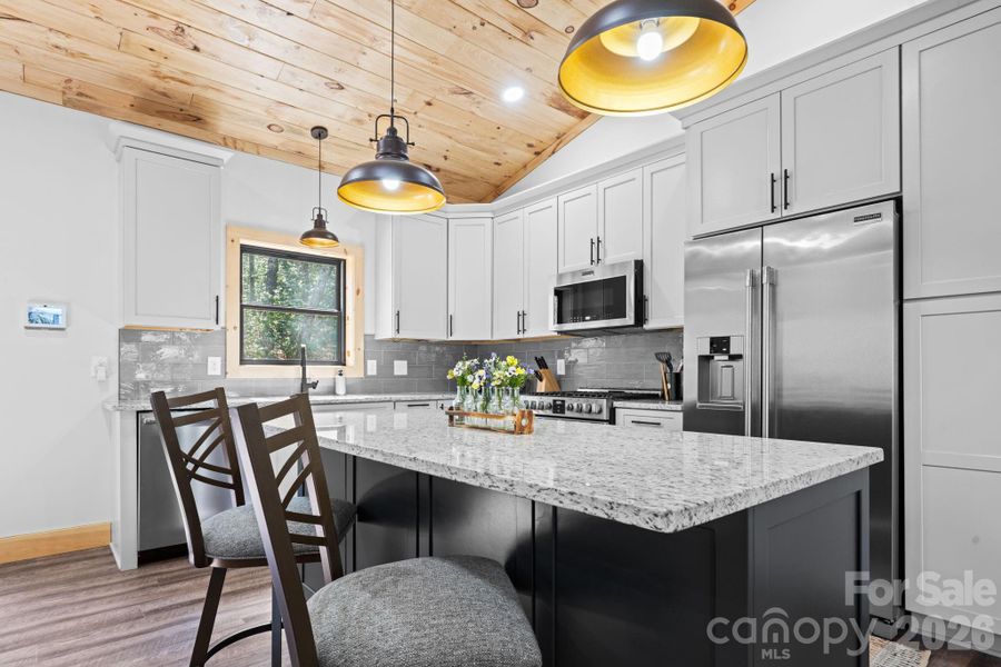 Kitchen offers granite counters and incredible cabinet space Kitchen offers granite counters and incredible cabinet space