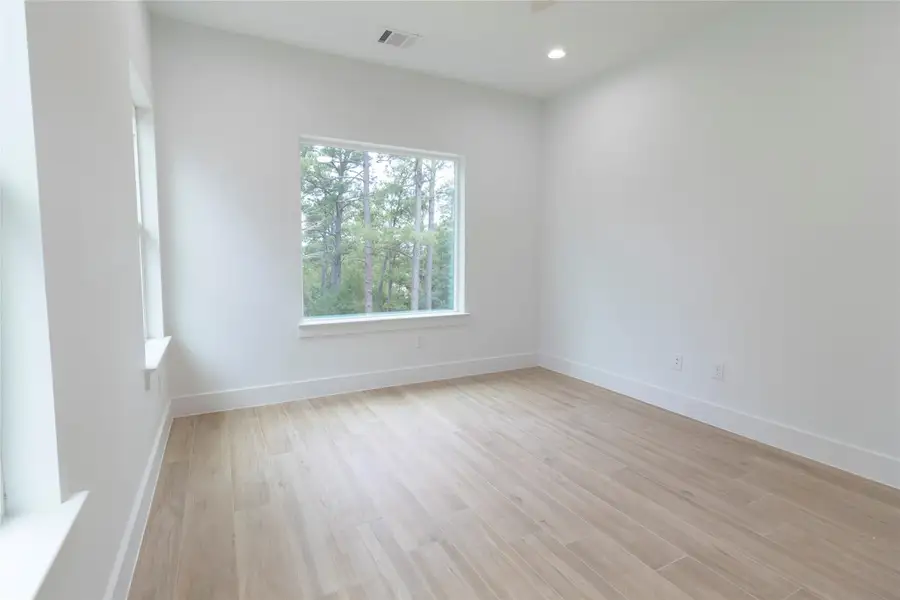 Spare room with light wood-style flooring and recessed lighting