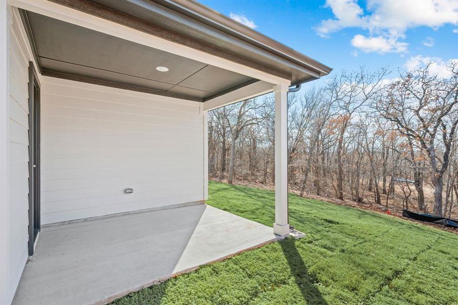 Exterior details and patio area of a home in Runaway Bay, Runaway Bay (Image 3).