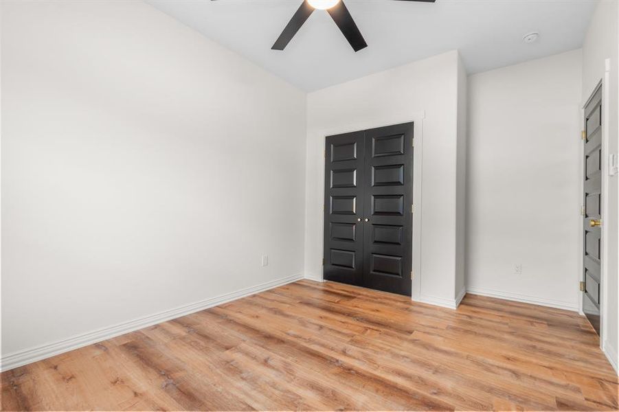 Foyer entrance with light wood-type flooring and a ceiling fan Foyer entrance with light wood-type flooring and a ceiling fan