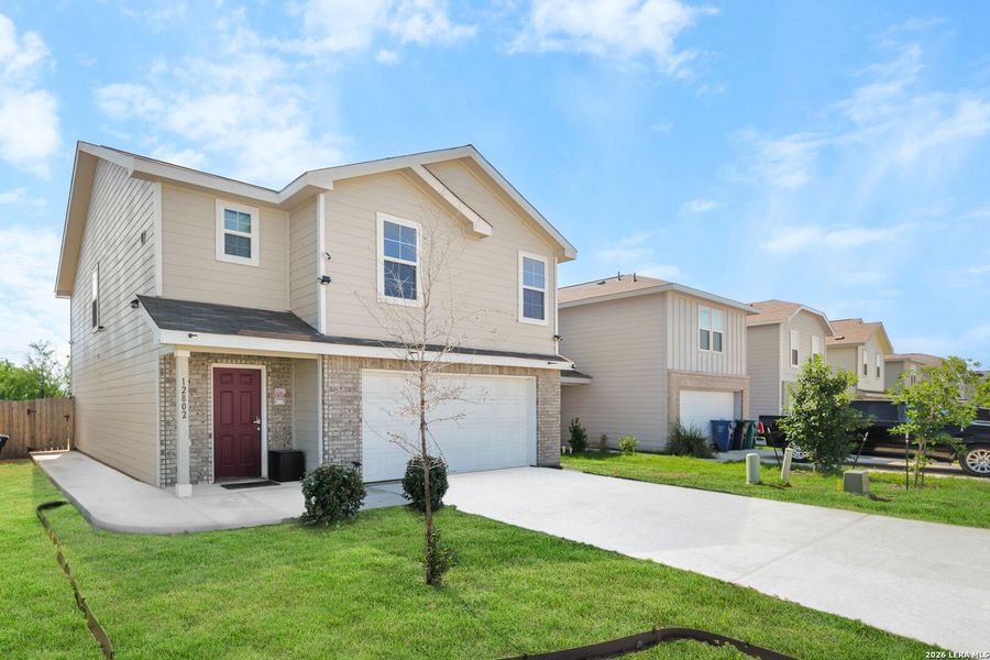Front exterior of a new home in Mission Del Lago, San Antonio, TX, highlighting curb appeal (Image 22).