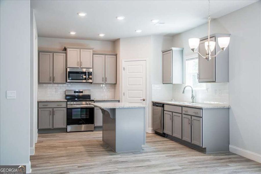 Furnished interior view inside a new home in Carson's Walk, Macon (Image 6).