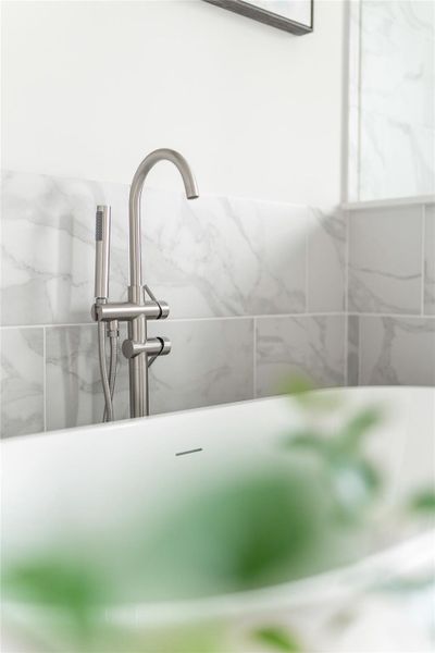 Luxurious primary bath with elegant fixtures and stunning marble accents, offering a spa-like retreat in your home. Luxurious primary bath with elegant fixtures and stunning marble accents, offering a spa-like retreat in your home.