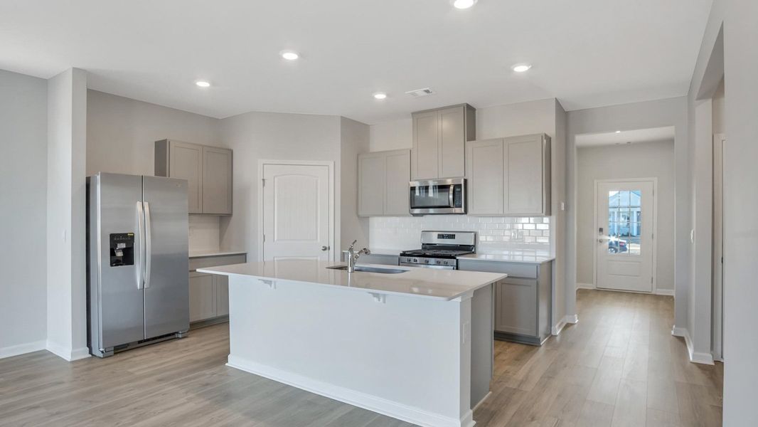 Representative furnished interior of a home built from the Arlington by D.R. Horton in Legacy Farms, White House (Image 28).