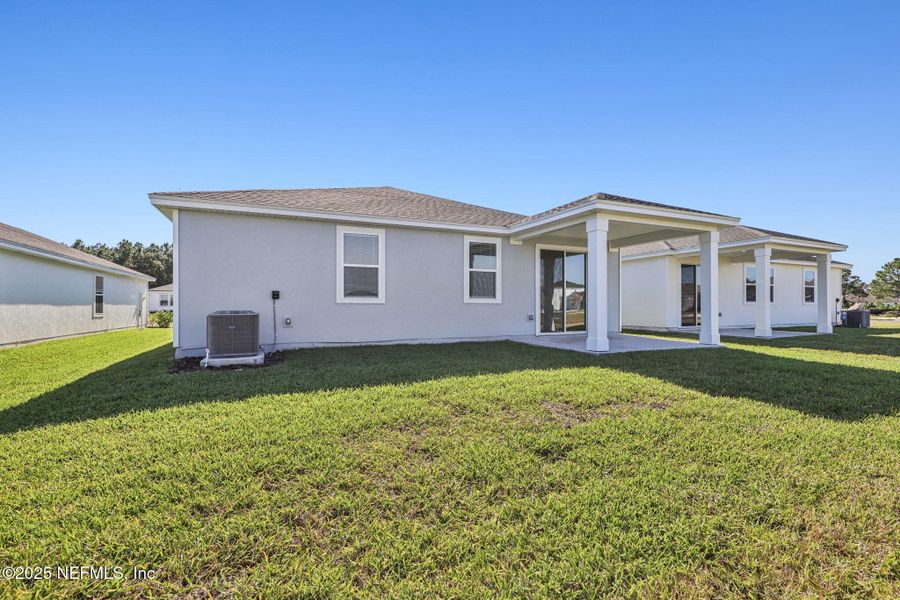 Exterior details and patio area of a home in Lakes at Bella Lago - Signature Series, Green Cove Springs (Image 4). Exterior details and patio area of a home in Lakes at Bella Lago - Signature Series, Green Cove Springs (Image 4).