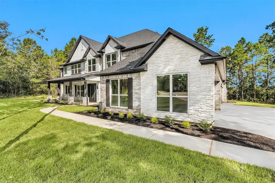 Front exterior of a new home in , Montgomery, TX, highlighting curb appeal (Image 2).