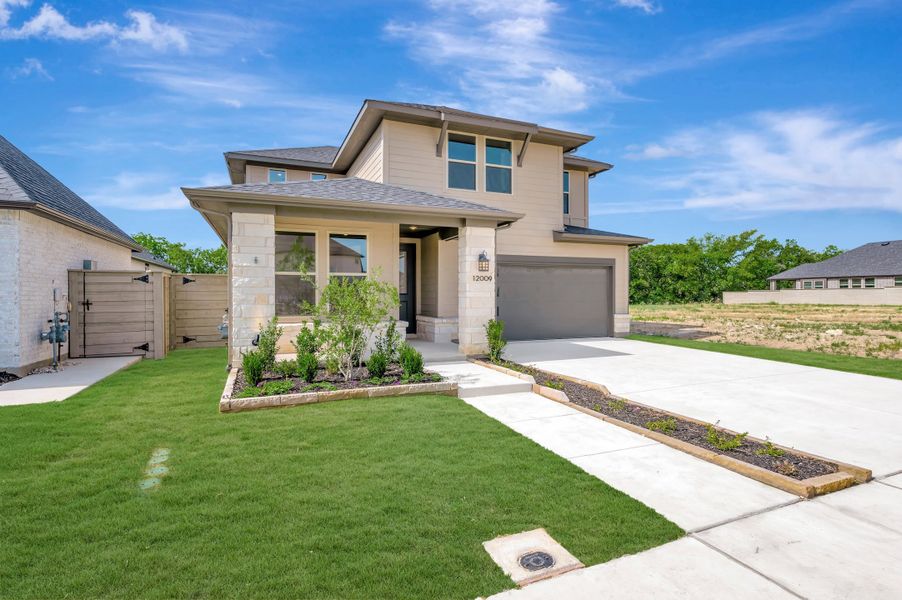 Front exterior of a new home in Treeline, Justin, TX, highlighting curb appeal (Image 21). Front exterior of a new home in Treeline, Justin, TX, highlighting curb appeal (Image 21).