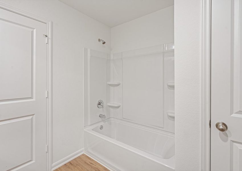 A shower/tub combination in the master bathroom