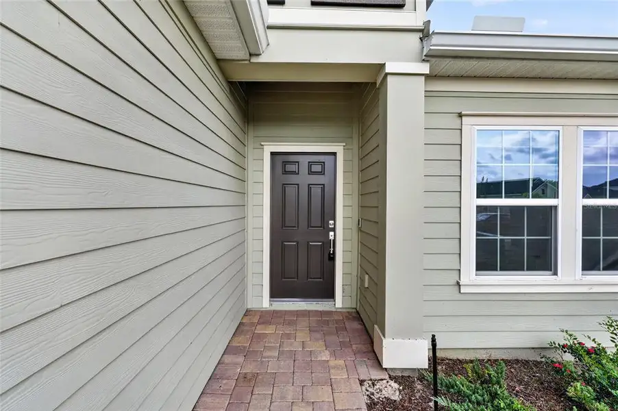 Exterior details and patio area of a home in Heath Preserve, Ocala (Image 26).