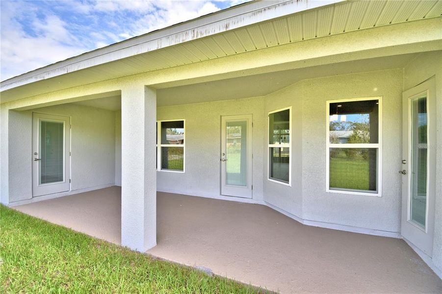 Exterior details and patio area of a home in Cadence Crossing, Auburndale (Image 30).