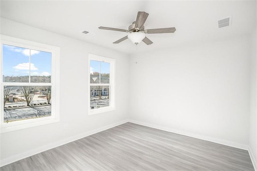 Spacious, unfurnished interior of a new home in The Cottages at East Lanier, Fairburn (Image 7).