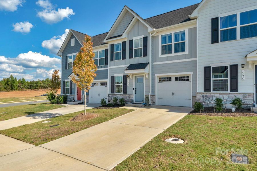 Front exterior of a new home in , Troutman, NC, highlighting curb appeal (Image 22).
