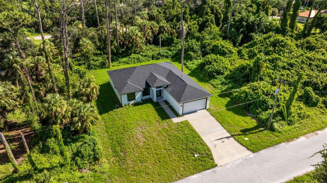 Front exterior of a new home in , Port Charlotte, FL, highlighting curb appeal (Image 20).