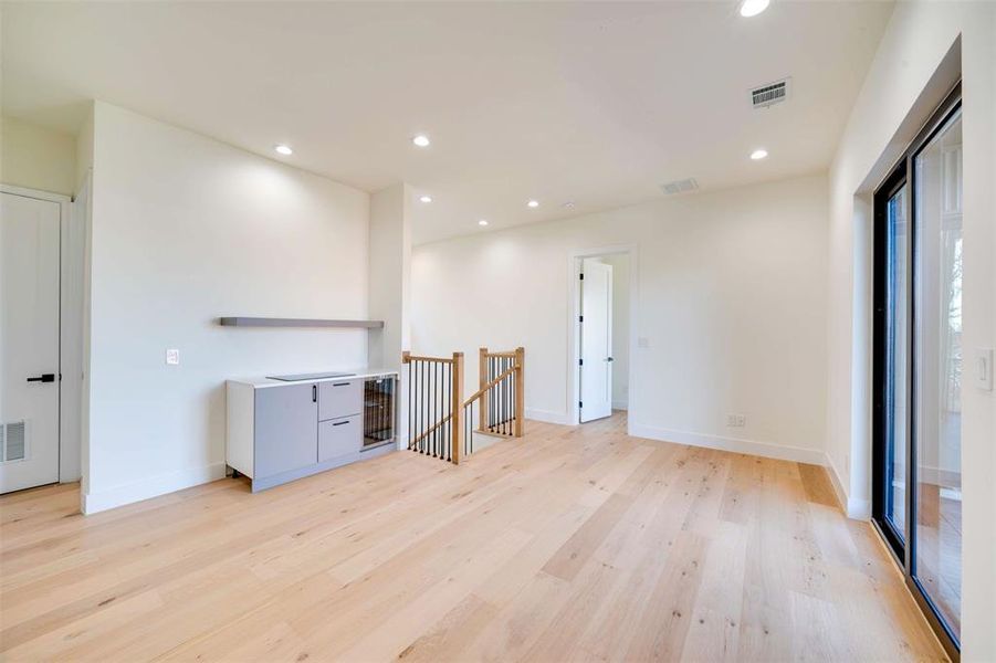 Spare room with light hardwood / wood-style floors