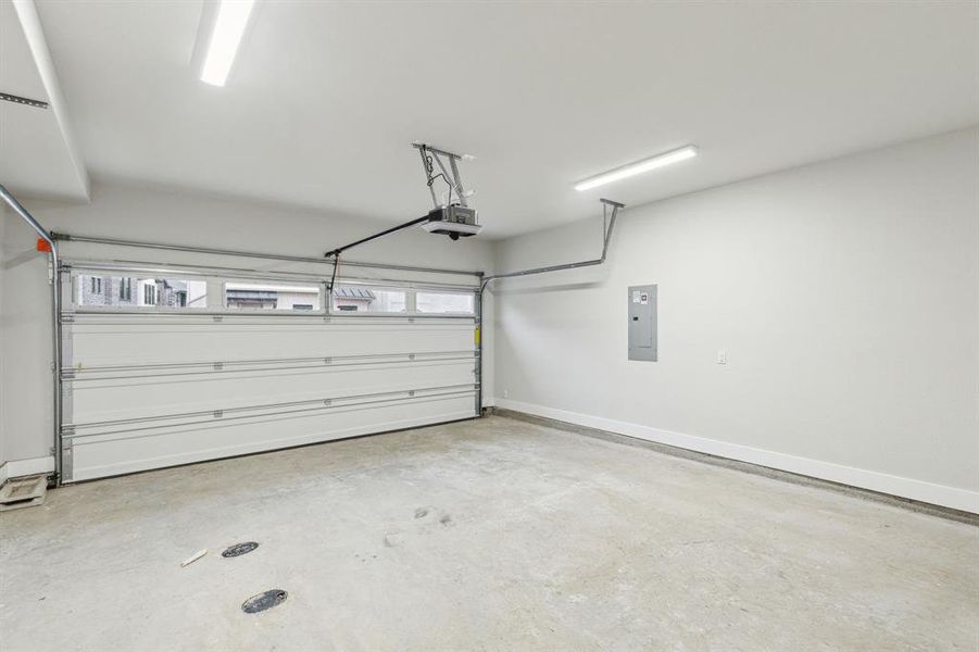 Garage with a garage door opener and electric panel