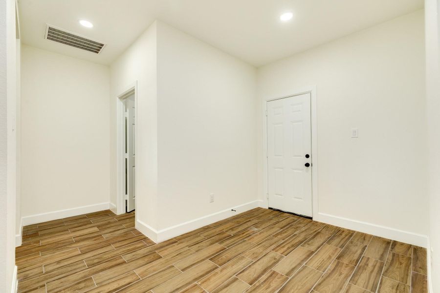 Flex space between the pantry and laundry room. Perfect for a mudroom, entering from the garage