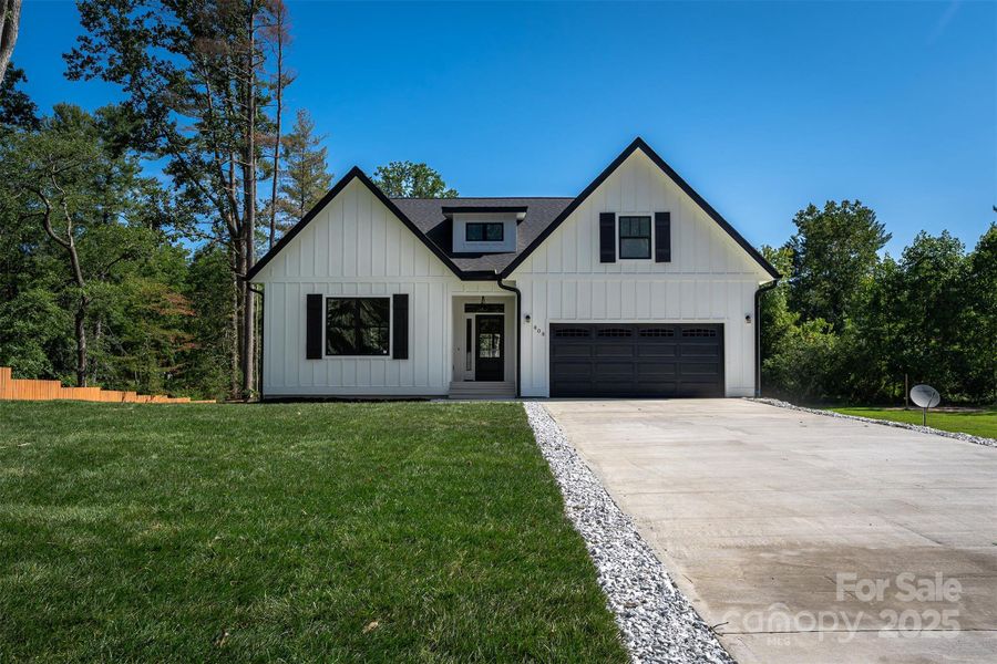 Front exterior of a new home in , Hendersonville, NC, highlighting curb appeal (Image 29).