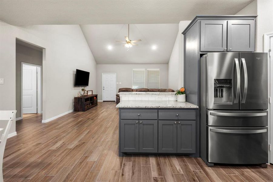 This amazing kitchen features an incredible amount of granite counter space to host and serve the largest of gatherings. Guests can sit and chat at the breakfast bar while entertaining.