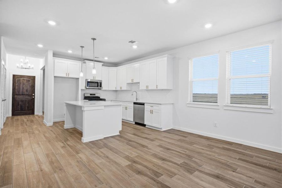 Furnished interior view inside a new home in , Iowa Colony (Image 6).