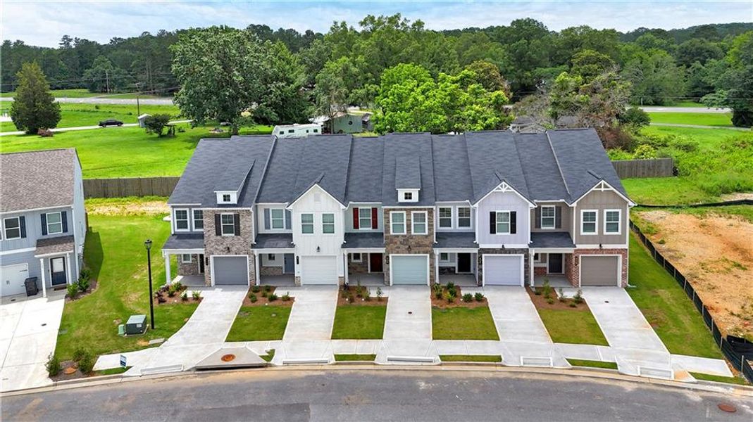 Front exterior of a new home in Village Green, Adairsville, GA, highlighting curb appeal (Image 24).