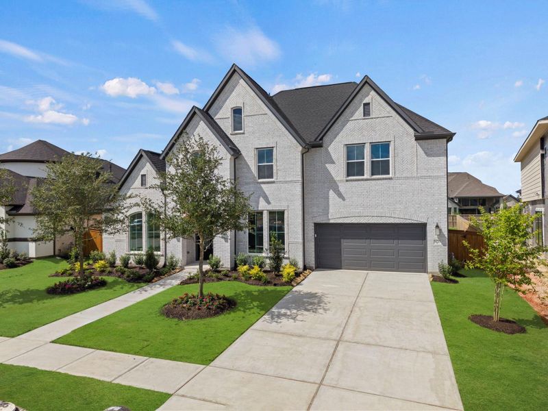 Front exterior of a new home in Dunham Pointe, Cypress, TX, highlighting curb appeal (Image 24).