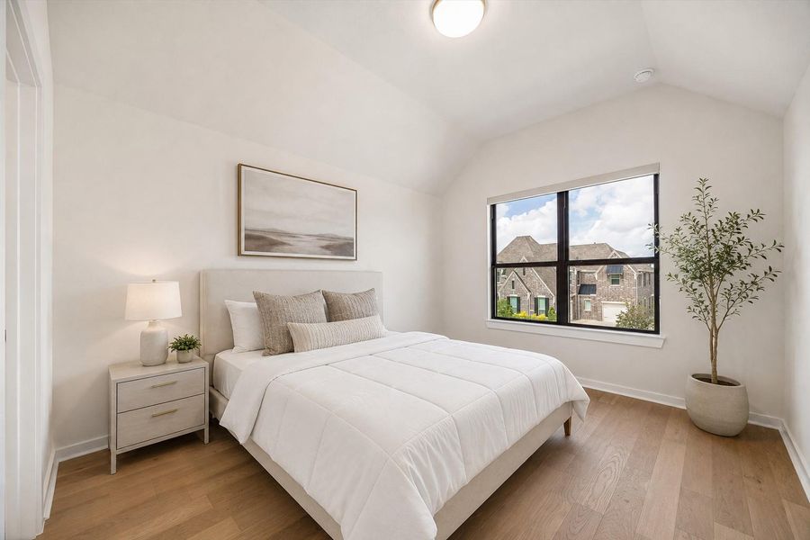 BEDROOM 5 OFFERS A HIGH CEILING, WOOD FLOORING, AND AN OVERSIZED WINDOW WITH NEIGHBORHOOD VIEWS. **Virtually Staged. BEDROOM 5 OFFERS A HIGH CEILING, WOOD FLOORING, AND AN OVERSIZED WINDOW WITH NEIGHBORHOOD VIEWS. **Virtually Staged.