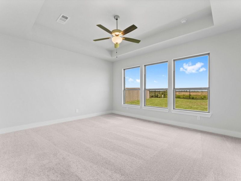 The Primary Bedroom with Walk-in Closet and Fan Can Accommodate a King-Sized Bed The Primary Bedroom with Walk-in Closet and Fan Can Accommodate a King-Sized Bed