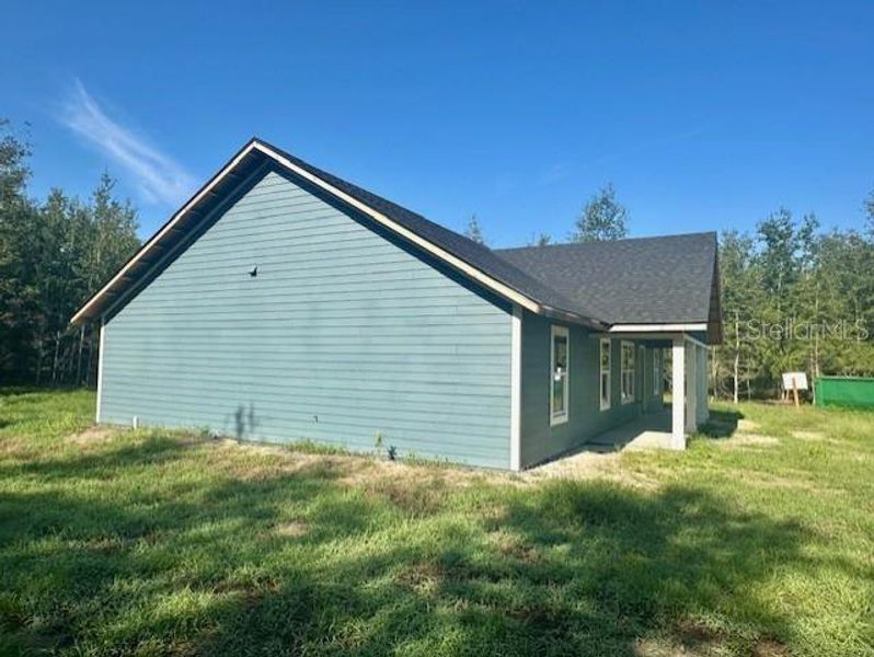 Front exterior of a new home in , Bell, FL, highlighting curb appeal (Image 1). Front exterior of a new home in , Bell, FL, highlighting curb appeal (Image 1).