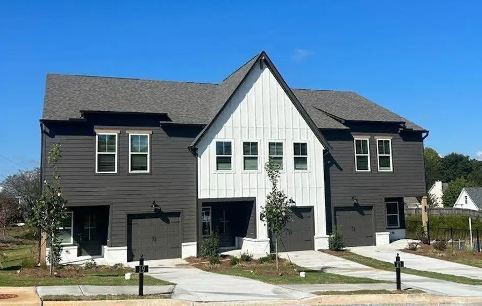 Front exterior of a new home in Downtown Fausett, Dawsonville, GA, highlighting curb appeal (Image 1). Front exterior of a new home in Downtown Fausett, Dawsonville, GA, highlighting curb appeal (Image 1).