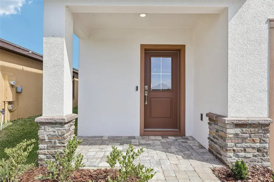 Exterior details and patio area of a home in Grasslands West, Lakeland (Image 4).