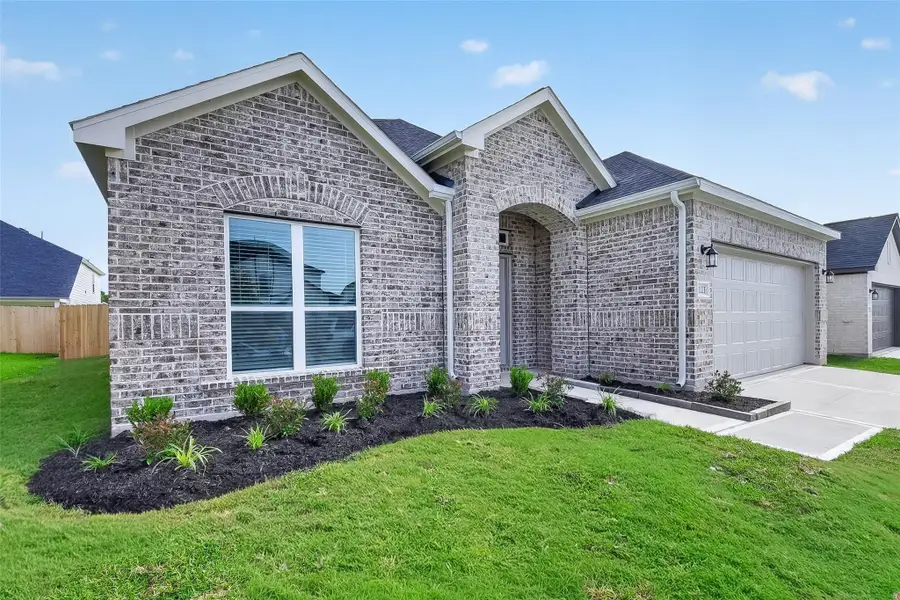 Front exterior of a new home in Rollingbrook Estates, Baytown, TX, highlighting curb appeal (Image 26).