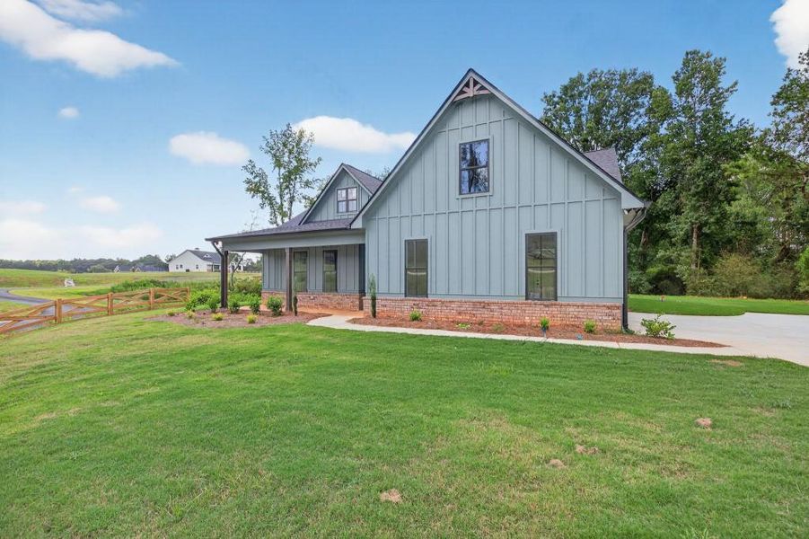 Front exterior of a new home in , Dallas, GA, highlighting curb appeal (Image 23).