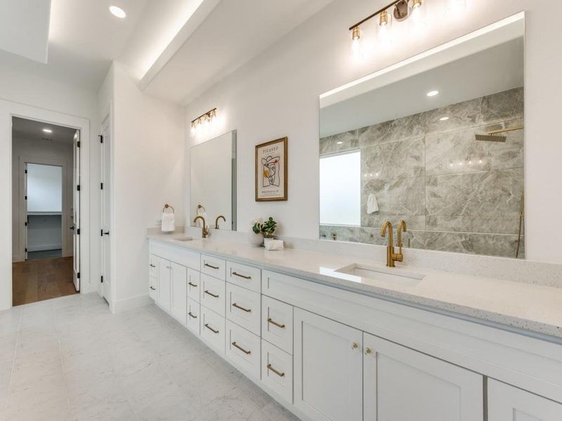 Bathroom with vanity and tiled shower