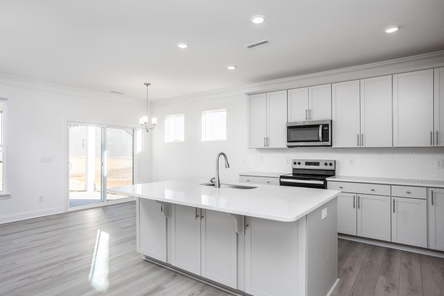 Furnished interior view inside a new home in 1158 Place, Wilson (Image 7).