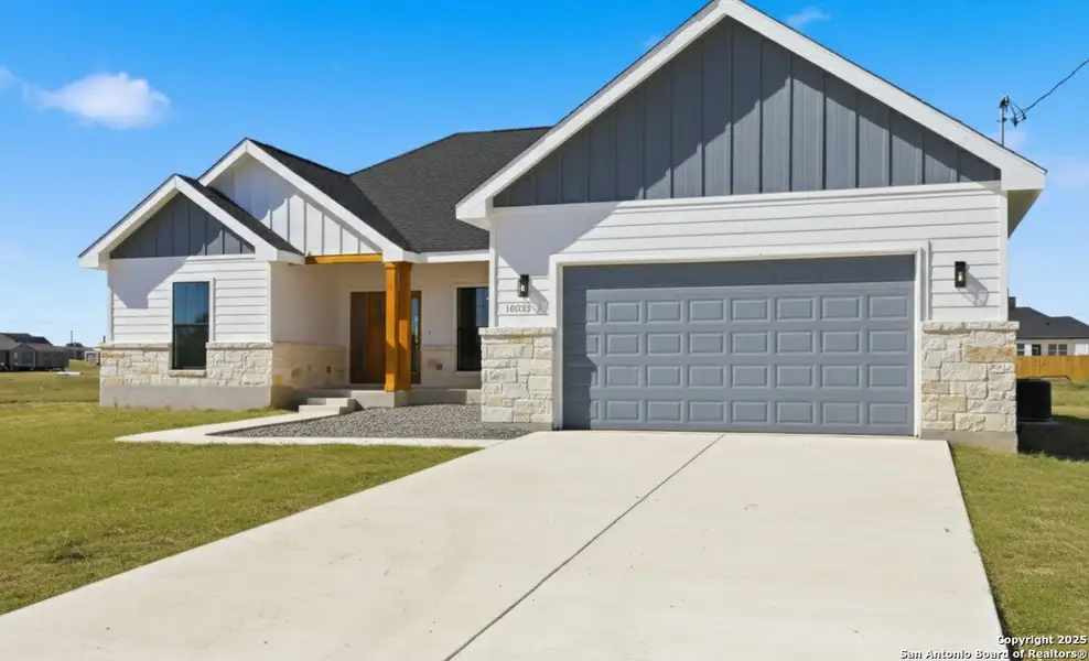 Front exterior of a new home in , Atascosa, TX, highlighting curb appeal (Image 2). Front exterior of a new home in , Atascosa, TX, highlighting curb appeal (Image 2).