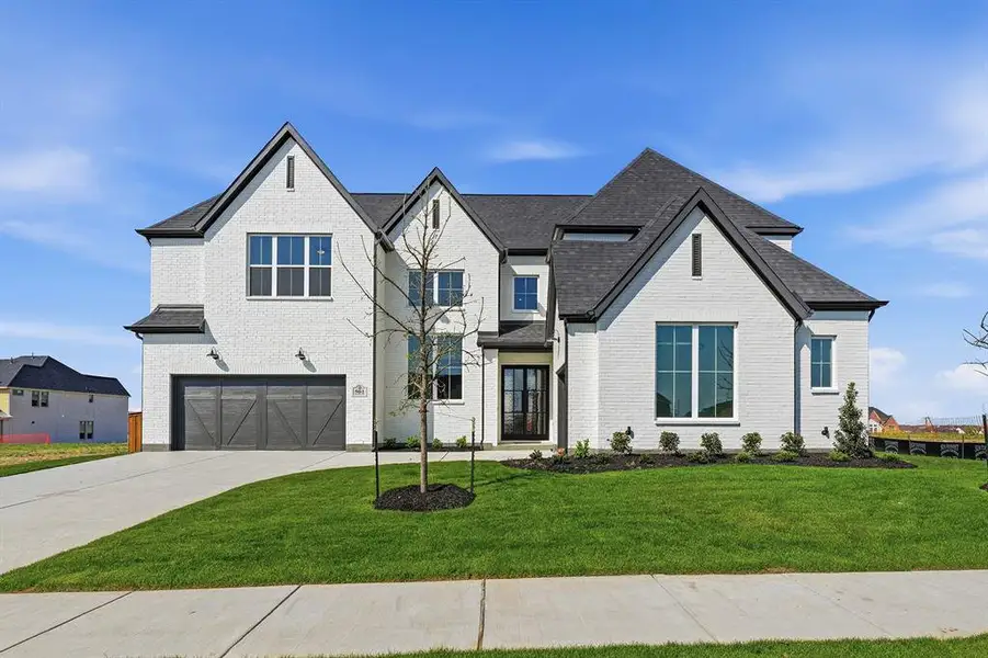 Front exterior of a new home in , Prosper, TX, highlighting curb appeal (Image 1). Front exterior of a new home in , Prosper, TX, highlighting curb appeal (Image 1).