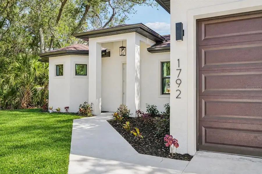 Exterior details and patio area of a home in , North Port (Image 3).