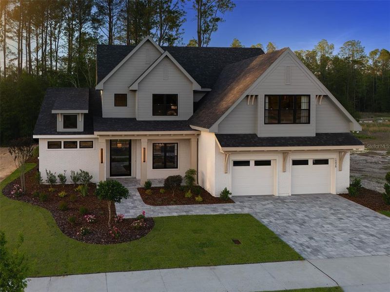 Front exterior of a new home in Laureate Village, Newberry, FL, highlighting curb appeal (Image 24). Front exterior of a new home in Laureate Village, Newberry, FL, highlighting curb appeal (Image 24).