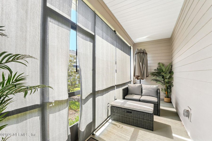 Exterior details and patio area of a home in Longbay Townhomes, Middleburg (Image 25).