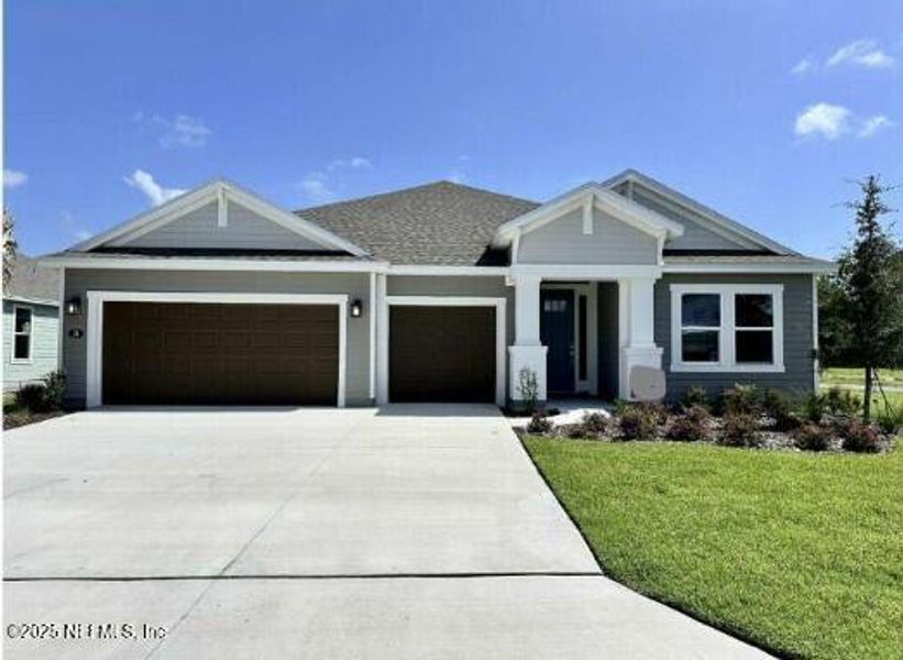 Front exterior of a new home in Colbert Landings, Palm Coast, FL, highlighting curb appeal (Image 1).