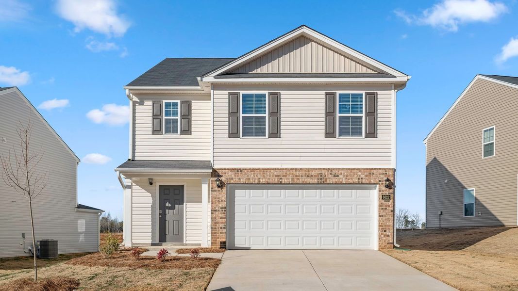 Front exterior of a new home in Willow Mill, Thomasville, NC, highlighting curb appeal (Image 1). Front exterior of a new home in Willow Mill, Thomasville, NC, highlighting curb appeal (Image 1).