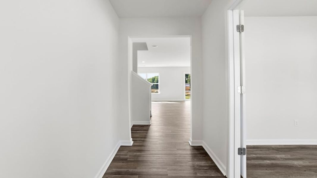 Spacious, unfurnished interior of a new home in Bentley Park, Greenwood (Image 13).