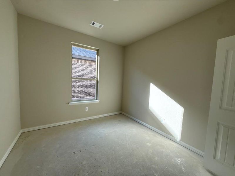Empty room featuring baseboards
