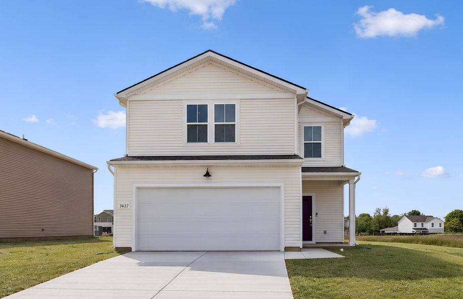Front exterior of a new home in Highlands of Carter's Station, Columbia, TN, highlighting curb appeal (Image 19).