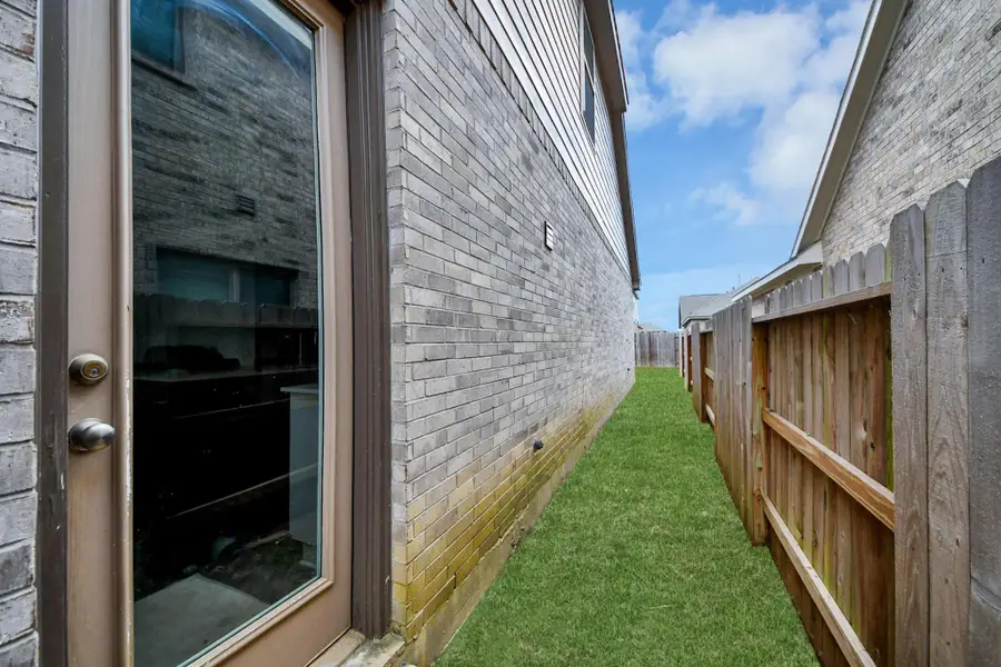 Exterior details and patio area of a home in The Trails, New Caney (Image 4).